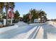Entrance to Siesta Beach is adorned with palm trees and signage, creating a welcoming gateway to the sandy shores at 5134 Northridge Rd # 106, Sarasota, FL 34238