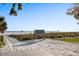 View of the sandy path leading to Siesta Beach, with a clear blue sky and the beach visible in the distance at 5134 Northridge Rd # 106, Sarasota, FL 34238