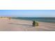 Picturesque beach view featuring a lifeguard station, soft sand, and clear ocean water at 5134 Northridge Rd # 106, Sarasota, FL 34238