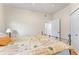 Bright bedroom featuring natural light, closet, and comfortable bedding at 5134 Northridge Rd # 106, Sarasota, FL 34238