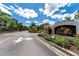 Serenade on Palmer Ranch entrance showcasing lush landscaping and an inviting community welcome sign at 5134 Northridge Rd # 106, Sarasota, FL 34238