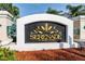 Community sign that reads 'Serenade on Palmer Ranch' and tropical foliage at 5134 Northridge Rd # 106, Sarasota, FL 34238