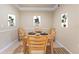Charming dining room featuring wood table, chairs, and decorative wall art at 5134 Northridge Rd # 106, Sarasota, FL 34238
