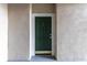 Front door of Unit 106 featuring a classic design with an elegant gold-tone door handle and number plate at 5134 Northridge Rd # 106, Sarasota, FL 34238