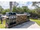 Built-in grilling station complete with stone accents and two separate gas grills at 5134 Northridge Rd # 106, Sarasota, FL 34238