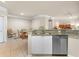 Open concept kitchen featuring granite countertops, stainless steel appliances, and tile flooring at 5134 Northridge Rd # 106, Sarasota, FL 34238