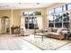 Inviting living room featuring large windows, stylish furniture, and a neutral color scheme at 5134 Northridge Rd # 106, Sarasota, FL 34238