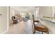 Open living room featuring tile flooring, ceiling fan, and access to the outdoor patio at 5134 Northridge Rd # 106, Sarasota, FL 34238