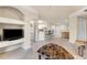 Open-concept living room, showing the adjacent kitchen with bar seating and dining area at 5134 Northridge Rd # 106, Sarasota, FL 34238