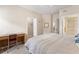 Bright main bedroom featuring tiled floors, and an ensuite bathroom at 5134 Northridge Rd # 106, Sarasota, FL 34238