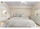 Main bedroom with ceiling fan, tiled floors and ensuite bath at 5134 Northridge Rd # 106, Sarasota, FL 34238