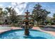 Beautiful community water fountain with blue water feature in front of a clubhouse at 5134 Northridge Rd # 106, Sarasota, FL 34238