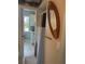 Bright bathroom featuring a shower with a stylish curtain, an oval mirror, and a neutral color scheme at 534 Lewis St, Englewood, FL 34223