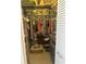 Walk-in closet with ample shelving and hanging space for clothes and accessories at 534 Lewis St, Englewood, FL 34223