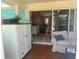 Bright sunroom with a sliding glass door leading to the interior living room at 534 Lewis St, Englewood, FL 34223