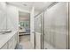 Bathroom with glass-enclosed shower, and access to bedroom and vanity at 5520 Coachwood Cv, Bradenton, FL 34211