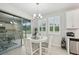 Cozy dining area showcases modern lighting, and access to an outdoor patio at 5520 Coachwood Cv, Bradenton, FL 34211