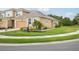 Inviting single-Gathering home boasts well-maintained landscaping and a cozy, neutral-toned exterior at 5520 Coachwood Cv, Bradenton, FL 34211