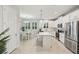 This kitchen boasts stainless steel appliances, sleek countertops, and a breakfast bar at 5520 Coachwood Cv, Bradenton, FL 34211