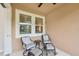Inviting screened lanai with outdoor seating, a ceiling fan, and neutral accents at 5520 Coachwood Cv, Bradenton, FL 34211