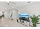 Bright and airy living room featuring tiled floors, plantation shutters, and stylish decor at 5520 Coachwood Cv, Bradenton, FL 34211