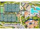 Aerial view of community amenities including tennis courts, swimming pool, and clubhouse with meticulously landscaped grounds at 5637 Arnie Loop, Bradenton, FL 34211
