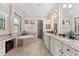 Luxurious bathroom featuring a soaking tub, walk-in shower, and double vanity at 5637 Arnie Loop, Bradenton, FL 34211