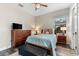 Cozy bedroom with wood floors, ceiling fan, window and furniture at 5637 Arnie Loop, Bradenton, FL 34211