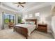 Spacious bedroom features a tray ceiling, large windows, and stylish furniture at 5637 Arnie Loop, Bradenton, FL 34211