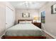 Bedroom with a ceiling fan, wood floors, closet and window at 5637 Arnie Loop, Bradenton, FL 34211