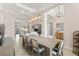 Bright dining room featuring tray ceilings, pendant lighting and tile floors open to the expansive living area at 5637 Arnie Loop, Bradenton, FL 34211