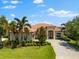 Beautiful single-story home with tile roof, well-manicured lawn, and lush landscaping at 5637 Arnie Loop, Bradenton, FL 34211