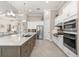 Bright kitchen with stainless appliances, stone countertops and a large island at 5637 Arnie Loop, Bradenton, FL 34211