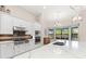 Bright kitchen with stainless appliances, stone countertops, tile backsplash and a bay window eating nook at 5637 Arnie Loop, Bradenton, FL 34211