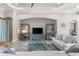 Well-lit living room with a glass table, display shelves, and comfortable seating at 5637 Arnie Loop, Bradenton, FL 34211