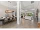 Spacious living room and dining room featuring tile floors, high ceilings, and lots of natural light at 5637 Arnie Loop, Bradenton, FL 34211