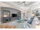 Bright living room featuring comfortable seating, a large TV, and stylish decor at 5637 Arnie Loop, Bradenton, FL 34211