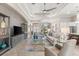 Open-concept living space with modern furnishings and a seamless flow to the dining area at 5637 Arnie Loop, Bradenton, FL 34211