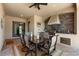 Outdoor kitchen with brick feature wall, grill, dining set and pool views at 5637 Arnie Loop, Bradenton, FL 34211