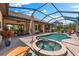 Relax in the backyard pool and spa, with a covered lanai area and outdoor seating for entertaining at 5637 Arnie Loop, Bradenton, FL 34211