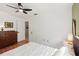 Well-lit bedroom featuring hardwood floors and white ceiling at 5728 Whistlewood Cir, Sarasota, FL 34232