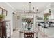 Bright dining area flows to the kitchen and outdoor pool area, great for entertaining at 5728 Whistlewood Cir, Sarasota, FL 34232