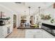 Kitchen and dining area are open concept with easy access to outdoor patio at 5728 Whistlewood Cir, Sarasota, FL 34232