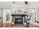 Open-concept view of the living room and kitchen area with modern appliances at 5728 Whistlewood Cir, Sarasota, FL 34232