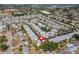 A tranquil community highlighted in an aerial view, showcasing manicured lawns and neighborhood layout at 6087 Coral Way, Bradenton, FL 34207