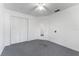 Bedroom with closet, neutral carpet, ceiling fan and white walls at 6087 Coral Way, Bradenton, FL 34207