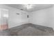 Bedroom with carpet, ceiling fan and closet in a bright, white room at 6087 Coral Way, Bradenton, FL 34207