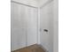 Clean entryway featuring closet space, a neutral-toned door, and coordinating neutral carpet providing a welcoming first impression at 6087 Coral Way, Bradenton, FL 34207