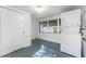 Laundry room with tile floors, a washer/dryer unit, and a closet at 6087 Coral Way, Bradenton, FL 34207