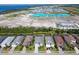 Aerial view of beautiful homes by a lagoon and the ocean at 6228 Champions Row St, Bradenton, FL 34210